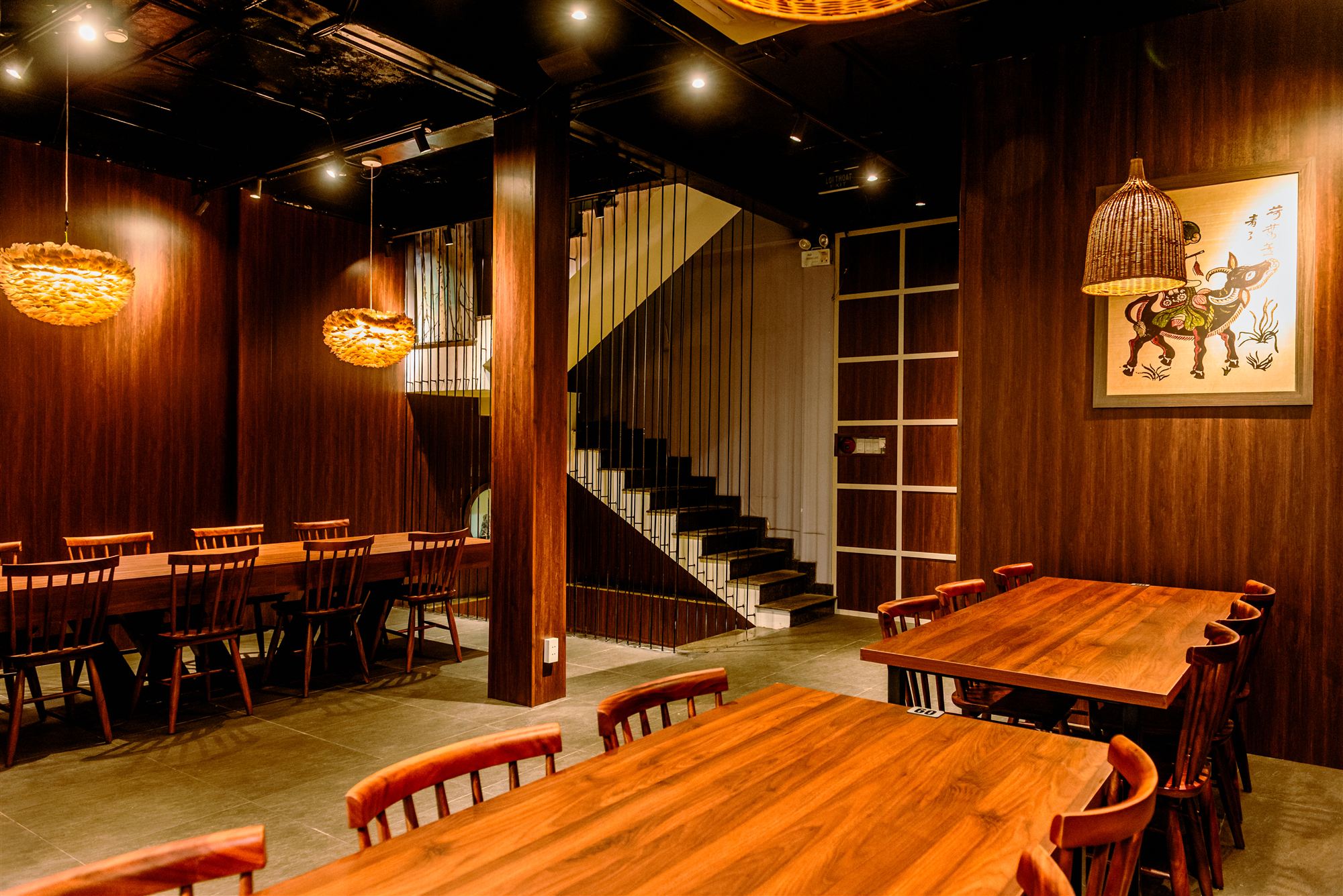 Ground floor dining hall leading to the upper level staircase