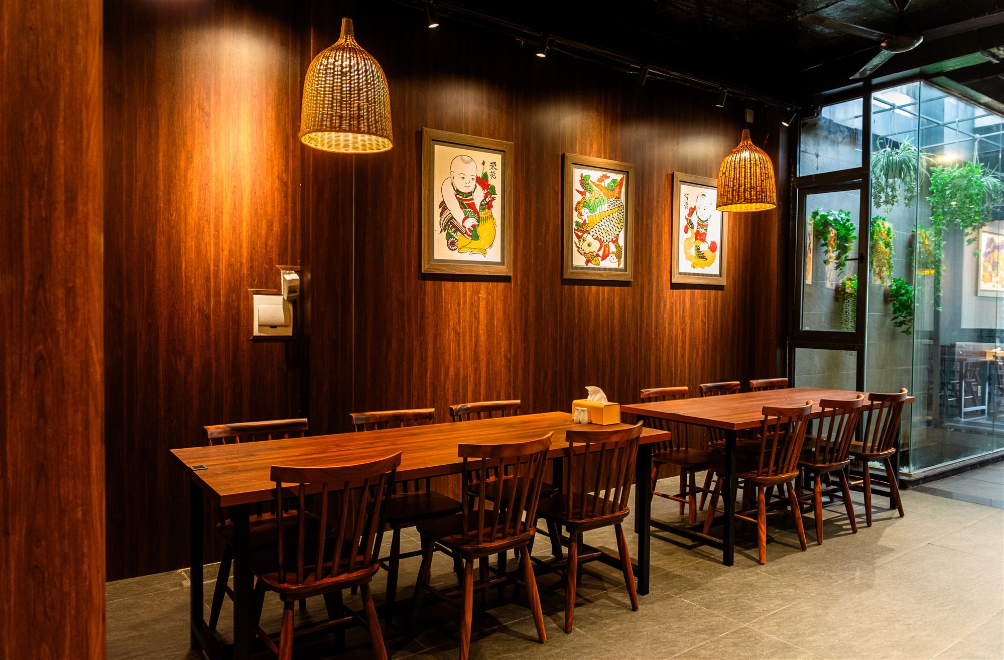 Intimate dining tables beside the courtyard at GOD-RESTAURANT