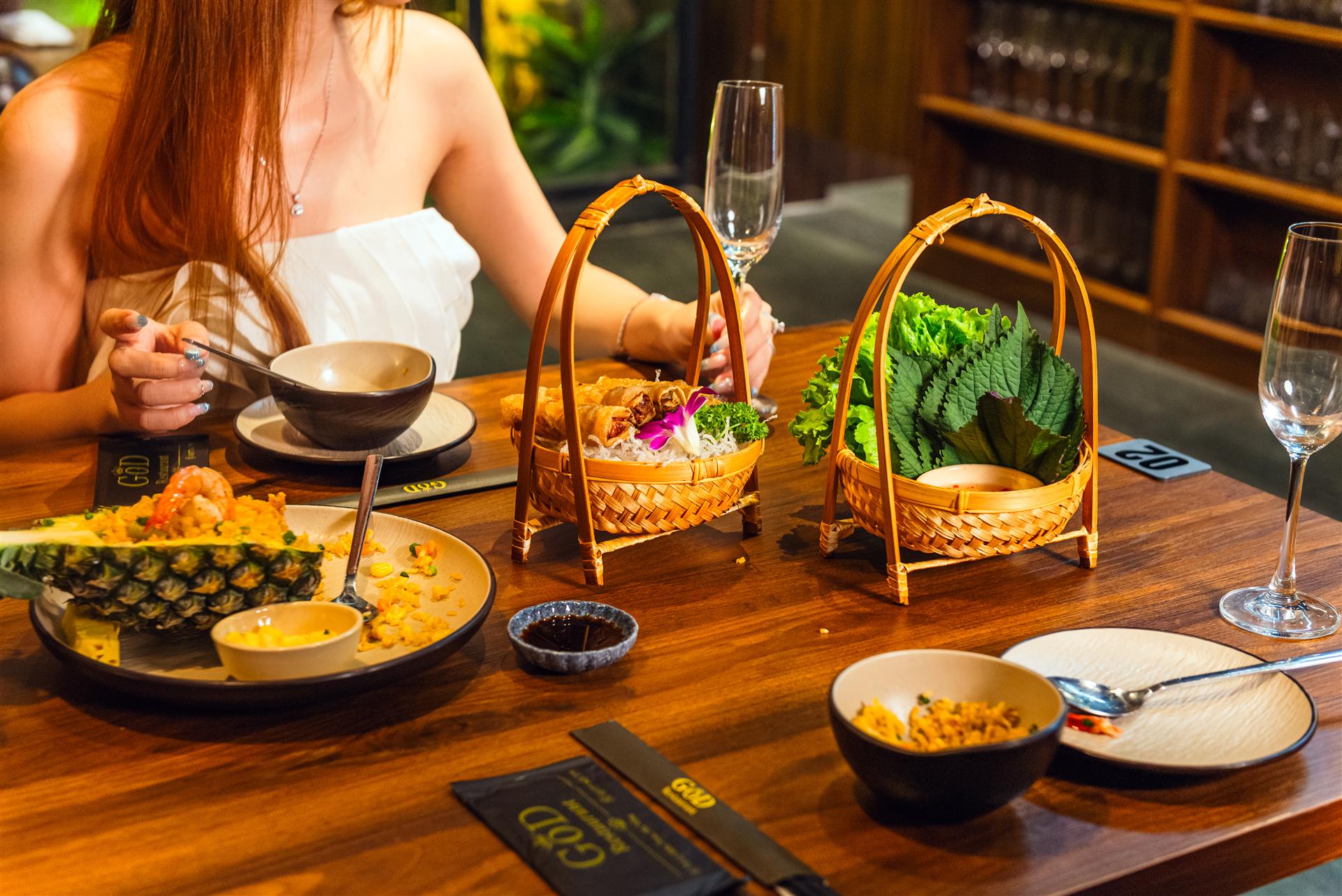 Guest enjoying fresh spring rolls at GOD-RESTAURANT