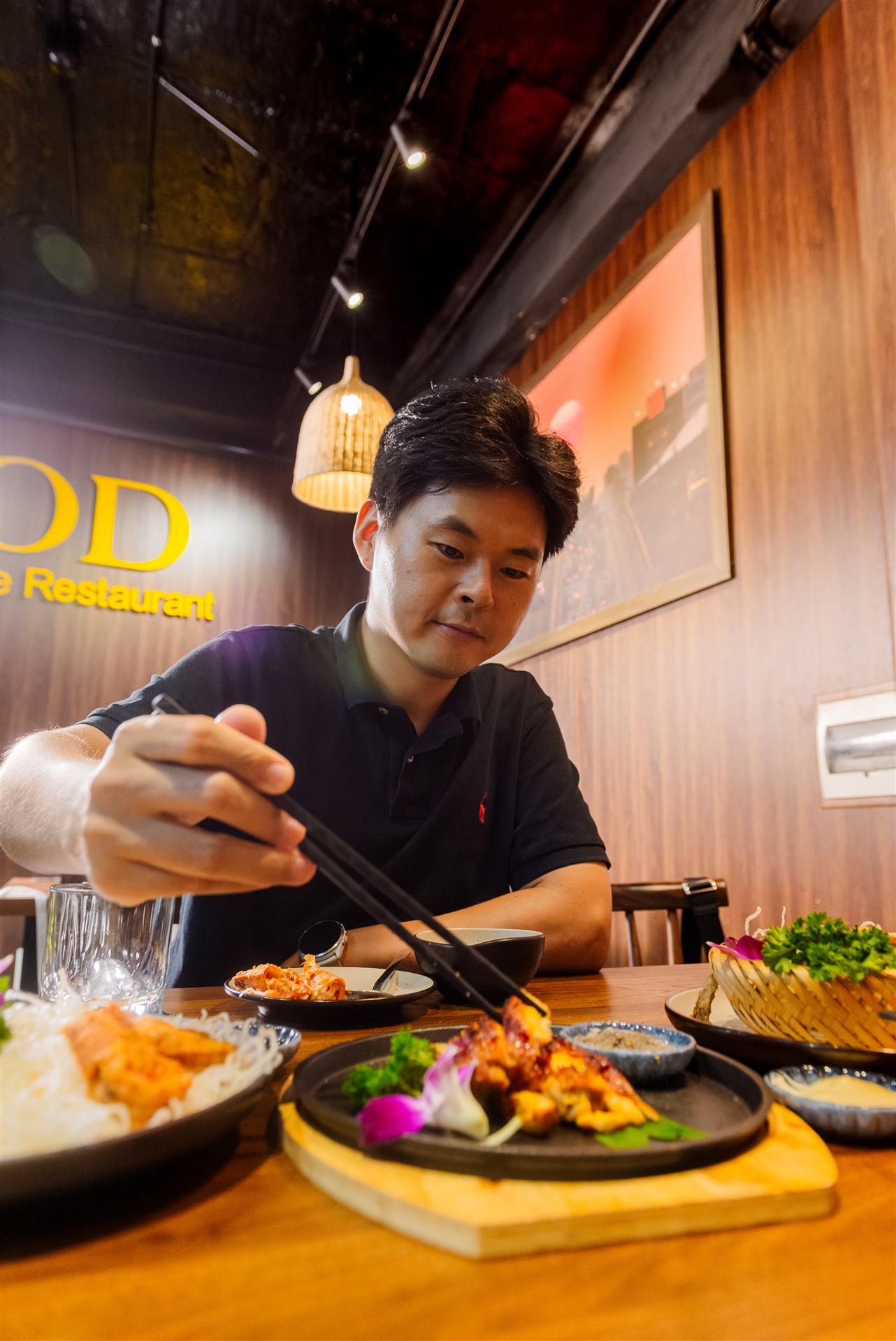 Guest savoring signature dishes at GOD-RESTAURANT